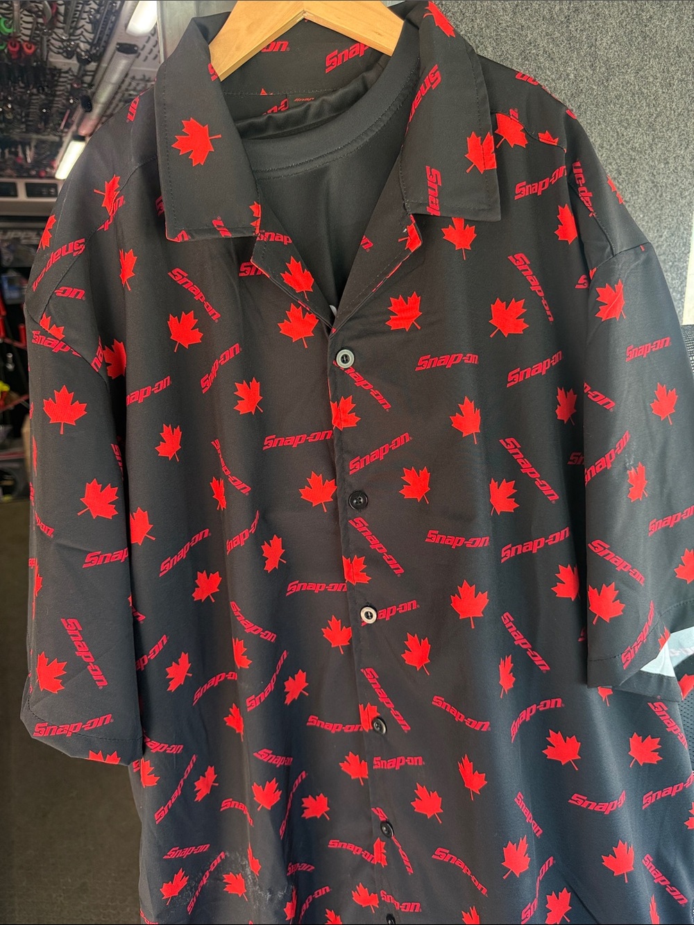 Snap-on Black Button-Up Shirt with Red Maple Leaf Print